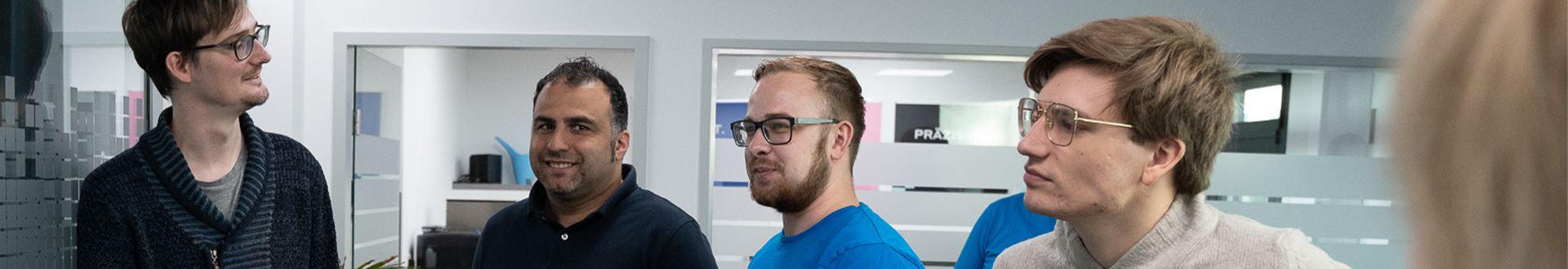 Five esatus team members reviewing a KYC architecture concept together
